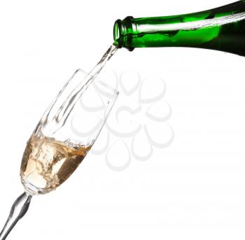 Champagne being poured into glass or flute, isolated on a white background.