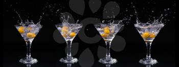 Set of Vermouth cocktail inside martini glass over dark background