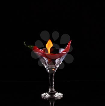 Flaming cocktail over black