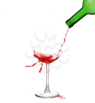 Broken glass with wine and drops ,isolated on white background