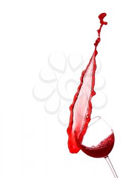 Red wine splashing from glass, isolated on white background