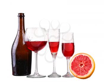 Set of glasses with red wine grapefruit