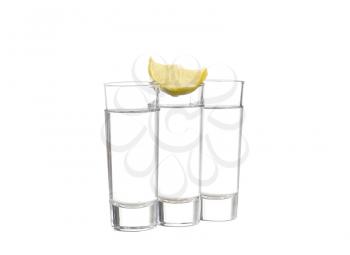 Three  tequila shots with lime isolated on white background