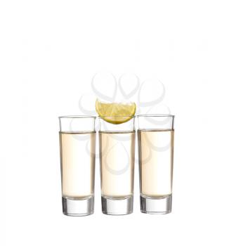 Three gold tequila shots with lime isolated on white background
