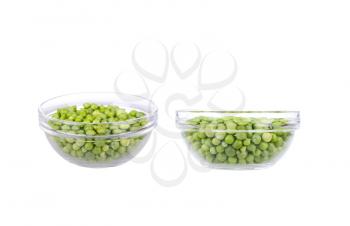 Fresh garden peas in a glass bowl.