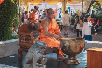 BANGKOK FEBRUARY 7 2016: Culture, features and Life of Thailand.  Unidentified local women give offerings to monks in the Wat Khlong Prao monastery. 