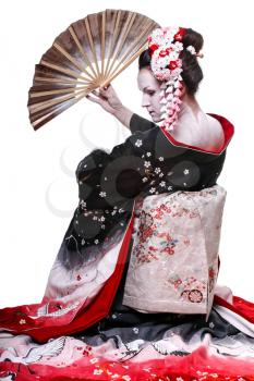 young pretty geisha in kimono with sakura and decoration. Portrait of a Japanese geisha woman isolated on white