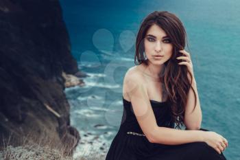 Portrait of beautiful young lady. Outdoors. Smoky eyes. 