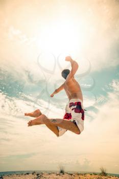 male beach volleyball game player jump on hot sand