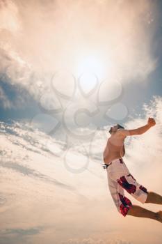 male beach volleyball game player jump on hot sand