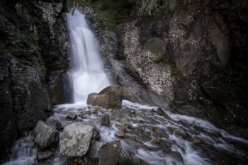 Nature stream waterfall in forest. Caucasus, Dombay, Shumka Falls