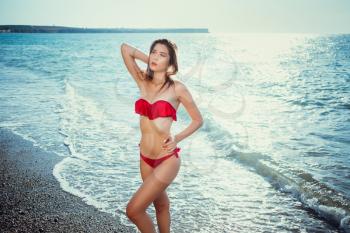 Summer beach vacation holidays woman happy joyful and laughing. Summer travel getaway concept with multiracial Asian Chinese / Caucasian woman in bikini in the sun