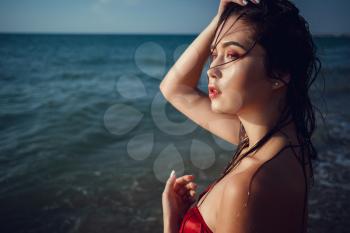 Summer beach vacation holidays woman happy joyful and laughing. Summer travel getaway concept with multiracial Asian Chinese / Caucasian woman in bikini in the sun