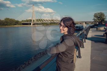 A girl on the Vistula waterfront, in Warsaw. Recreation and hiking in the lung