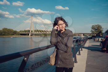 A girl on the Vistula waterfront, in Warsaw. Recreation and hiking in the lung
