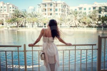 beautiful woman on a street of Dubai city. Beautiful Slavic girl in a beautiful residential complex in the center of Dubai.