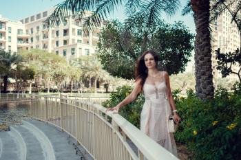 beautiful woman on a street of Dubai city. Beautiful Slavic girl in a beautiful residential complex in the center of Dubai.