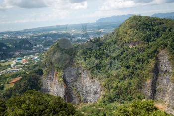 The top of Tiger Cave temple, Wat Tham Suea , Krabi region, Thailand. At the top of the mountain there is a large golden Buddha statue which is a popular tourist attraction.