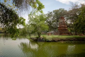 Old Beautiful Thai Temple wat Mahathat, Ayutthaya Historical Park, Ayutthaya, Thailand. Green part of historical park