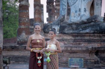 Sukhothai,Thailand - April ,9,2017: Beautiful Thai women in traditional costume of Thailand at Temple in Sukhothai Historical Park, Thailand.