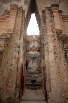 Seated Buddha image at Wat Si Chum temple in Sukhothai Historical Park, a UNESCO world heritage site in Thailand