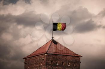 Flag with original proportions. Closeup of grunge flag of Belgium.