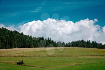 Meadow scenery landscape with blue sky concept. Tatra, border of Poland and Slovakia