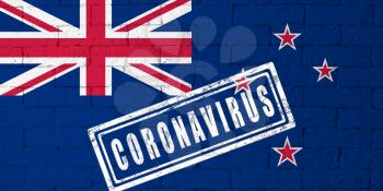 Flag of the New-Zeland with original proportions. stamped of Coronavirus. brick wall texture. Corona virus concept. On the verge of a COVID-19 or 2019-nCoV Pandemic.
