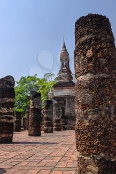 Sukhothai Historical Park, a UNESCO World Heritage Site in Thailand, beautiful flowering park and old chedi ruins, mobile photo