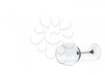 empty wine glass lies on glass Isolated on a white background
