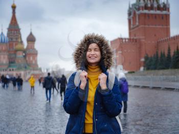 Asian tourist in travel vacations in winter Moscow. woman posing in cold Red Square in central Moscow,