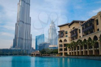 DUBAI, UNITED ARAB EMIRATES - FEBRUARY 10, 2021: Bottom-up view of Burj Khalifa in contrast with the blue sky and clouds. Burj khalifa, the highest building in the world, Downtown