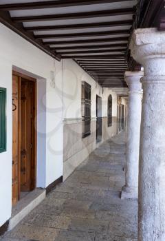 Pillars and covered walkway under balcony in town square of Almagro in Castilla-La Mancha, Spain, Europe