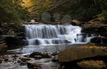 Cascade of waterfall into swimming hole with blurred motion on Deckers Creek running by Route 7 near Masontown in Preston County West Virginia