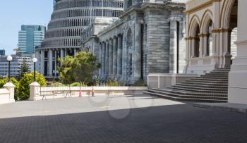 Parliamentary Library building in Wellington New Zealand with Parliament House and Beehive in background