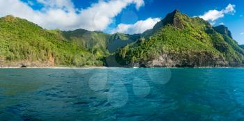 Hanakapiai beach on Na Pali coastline in Kauai from sunset cruise