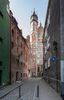 Narrow street with view of brick exterior of the archaeological museum in Gdansk