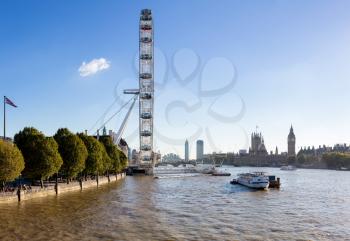 LONDON, UK - OCTOBER 1, 2015: London Eye or Millenium Wheel on South Bank of River Thames in London England