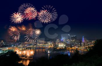 PITTSBURGH, PA - JULY 4, 2018: Fireworks from the river in front of downtown Pittsburgh on Independence Day.