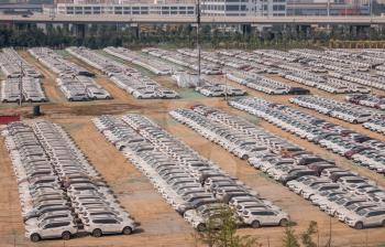 Thousands of new white chinese cars ready for delivery in ZhengZhouDong in China
