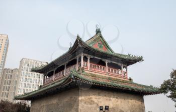 Ornate roof of Yuhuang Pavilion in the Ancient Cultural Street in Tianjin, China surrounded by apartment blocks