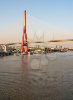 Huangpu river in Shanghai towards Yangpu bridge at sunset