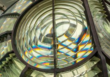 Close image of the glass prisms making up a fresnel lens in a lighthouse