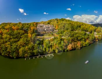 Aerial drone shot of the autumn trees surrounding townhouse development by Cheat Lake in Morgantown, West Virginia