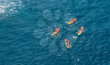 Kayakers or canoeists in the sea by the city walls in Dubrovnik