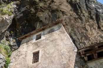 Famous castle of Predjama built into a cave in mountain in Slovenia