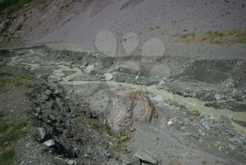 Mountain landscape. Highlands, the mountain peaks, gorges and valleys. The stones on the slopes.