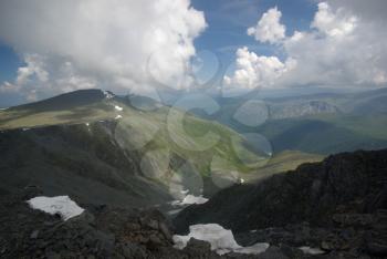 Mountain landscape. Highlands, the mountain peaks, gorges and valleys. The stones on the slopes.