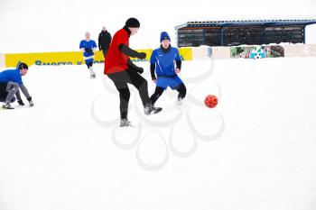 Football game. Training matches junior teams and fans.