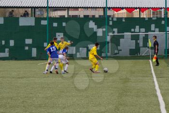 Football game. Training matches junior teams and fans.